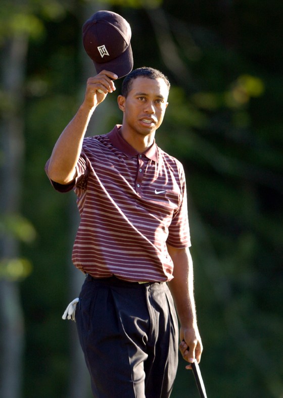 Tiger Woods tips his hat to the crowd during the final round of the Deutsche Bank Championship in Norton