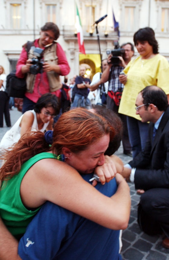 Friends and relatives of aid worker Simona Torretta gathered outside the Italian premier's office in Rome on Tuesday.