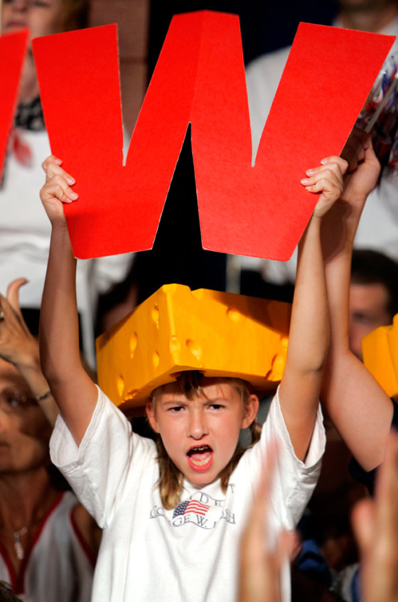 A young girl shows support for President Bush at a campaign rally in Wisconsin