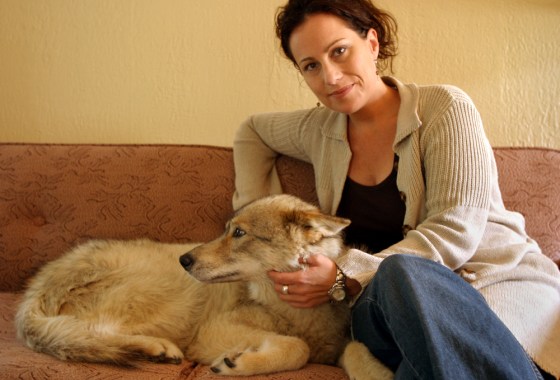 Maleah Jacobs, an animal communicator, sits in her Seattle home Sept. 10 with Mica, one of her clients.