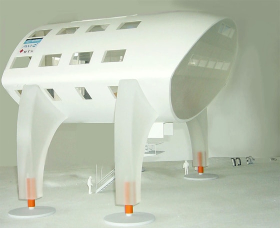 The&nbsp;SpaceHouse proposal for the Neumayer III Antarctic station has a futuristic linear shape. Shown here is a model of&nbsp;one-third of the final structure, which would use 12 legs for support. The small figures at the base of the structure are scale models of humans.