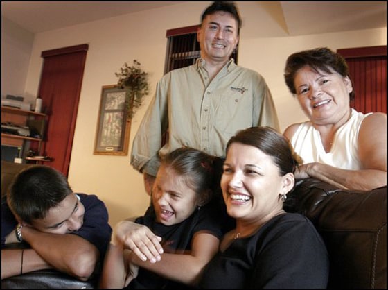 The O'Kimosh family, recently relocated to the DC area from their native Wisconsin, and still go back home to visit frequently.&nbsp; Pictured, James O'Kimosh, standing, with his family in their Germantown home.&nbsp; L-R: Kyle, 14, Shania, 8, James, Stacie, and Bernie Holstrom, Stacie's mother.&nbsp;&nbsp;&nbsp; 