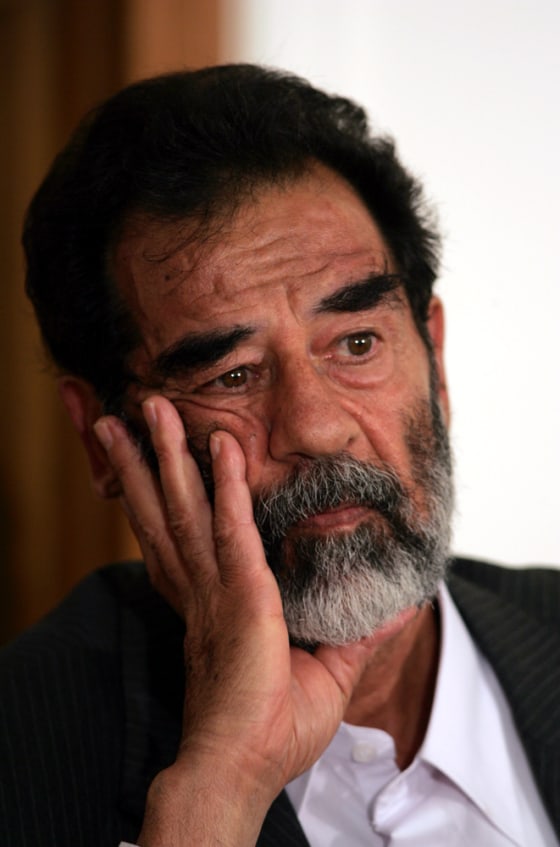 In this July 1 file photo cleared by the U.S. military, Saddam Hussein appears in a courtroom at Camp Victory, on the outskirts of Baghdad.