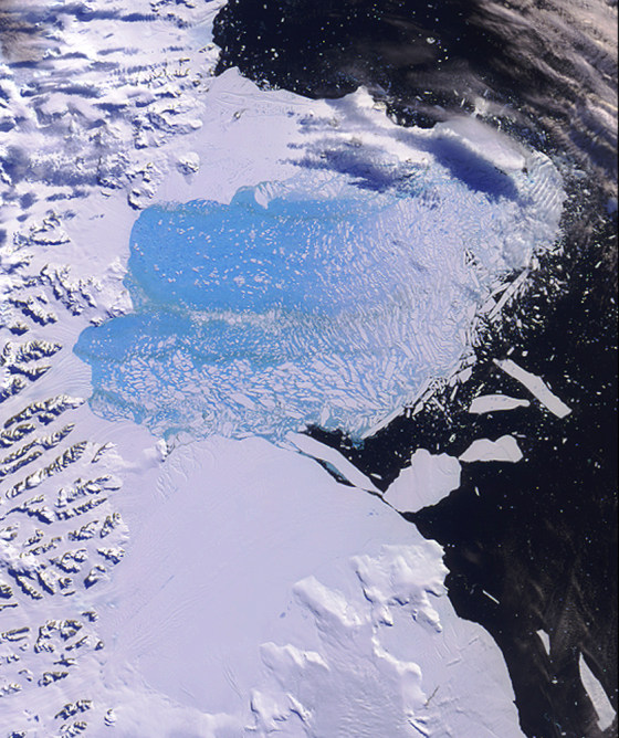 The Larsen B ice shelf on Antarctica is seen during its breakup in February and March of 2002. Scientists worry that collapsing ice shelves will allow ice sheets trapped on the continent to flow into the sea, raising levels worldwide.