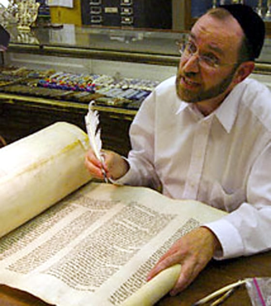 Rabbi Menachem Youlus restores a Torah that survived the Holocaust in Europe.