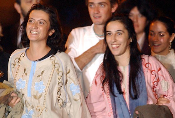 Aid workers Simona Pari, left, and Simona Torretta arrive at Rome’s Ciampino military airport Tuesday night.