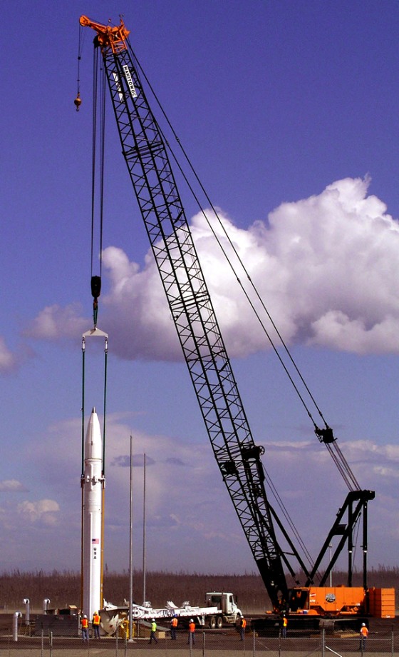 Workers lower a ground-based missile interceptor into its silo near Delta Junction, Alaska, in July.