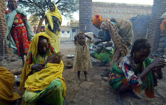 Displaced Sudanese women prepare tea at a MSF hospital at Golo, west Darfur