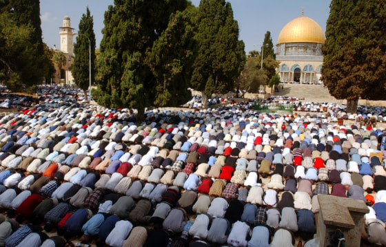 Thousands of Muslim worshippers pray at the Al-Aqsa Mosque compound in Jerusalem's Old City on Friday.