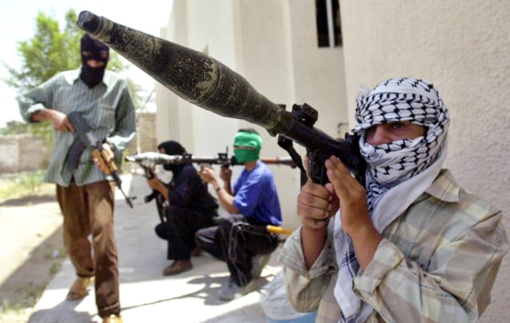Fighters loyal to radical Shiite cleric Muqtada al-Sadr take up positions in the southern Iraqi city of Basra in August.