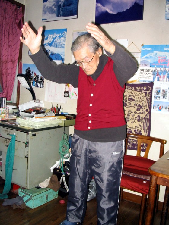 Keizo Miura, 100, the oldest man to climb Mount Kilimanjaro in 1981, and who skied down Mont Blanc last year, does his morning exercise routine in Tokyo on Oct. 22.