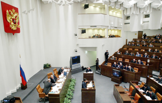 Members of Russia's upper house of parliament vote to endorse the Kyoto protocol, in Moscow, on Wednesday.