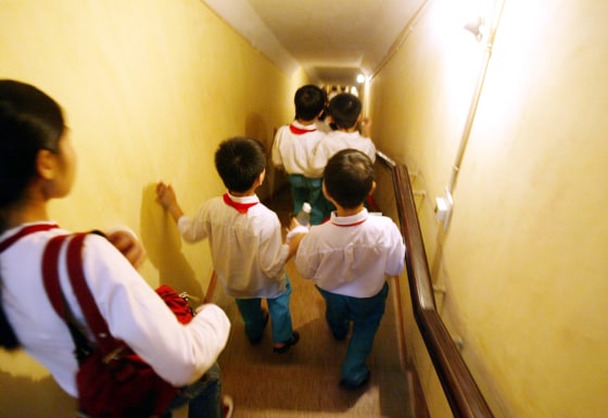 VIETNAMESE SCHOOLCHILDREN VISIT SITE OF FORBIDDEN CITY AND MILITARY BUNKER