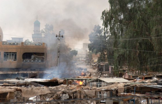 A U.S. Army photo shows buildings and debris burning in Fallujah on Tuesday.