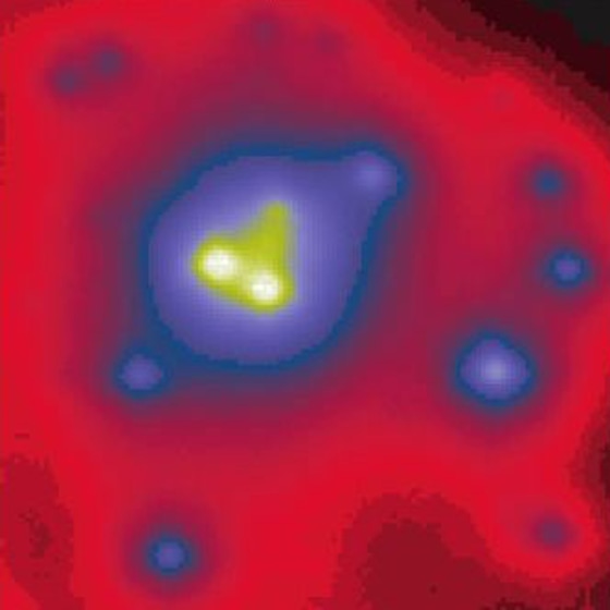 A dense cluster of seven massive stars appears to spiral around an intermediate-mass black hole. The whole setup orbits the Milky Way's central supermassive black hole, not show here. 