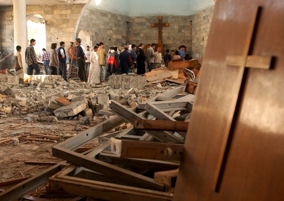 Iraqis gather inside the damaged St. Matthew Church in Baghdad, Iraq, on Nov. 9 following a car bomb attack.
