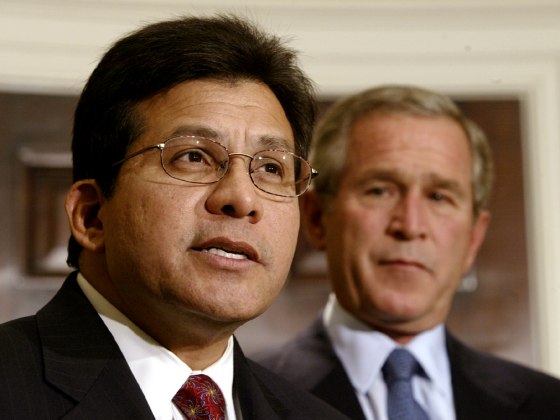 U.S President George W. Bush listens to his attorney general nominee Alberto Gonzales in Washington