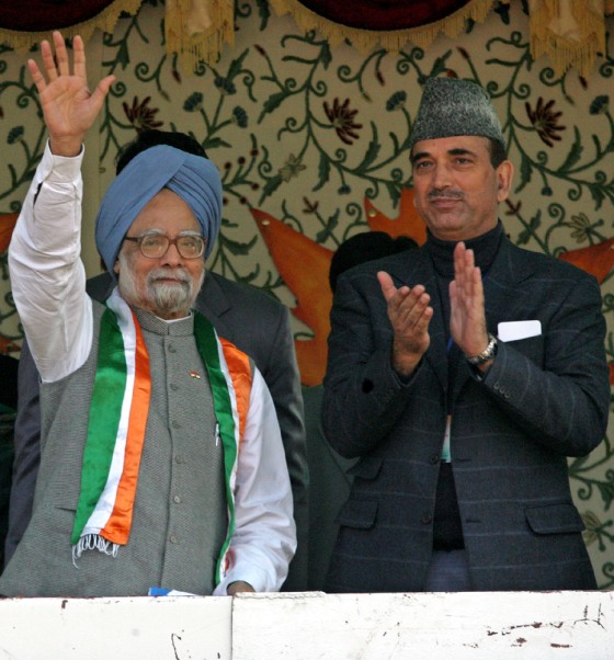 Indian Prime Minister Singh waves during public rally in Srinagar