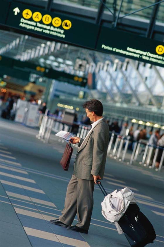 Checking an itinerary at the airport.
