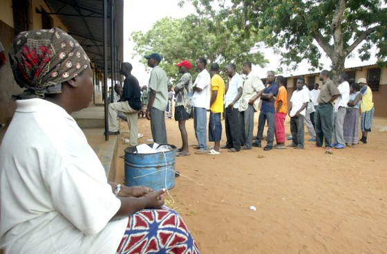 Voters wait in line to cast their ballots for president Wednesday in Polana, just outside Maputo, Mozambique.