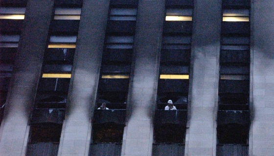 Investigators are seen taking photos from the windows of the LaSalle Bank building in Chicago late Tuesday.