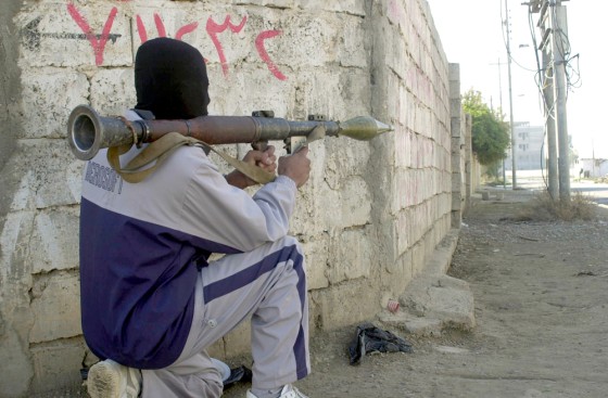 An insurgent aims a rocket propelled grenade in Mosul on Dec, 3. U.S. officials believe the anti-U.S. forces are slipping over the border from Syria.