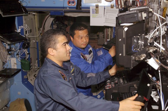 Kyrgyz-Russian cosmonaut Salizhan Sharipov and NASA astronaut Leroy Chiao conduct a training exercise in the international space station's Destiny laboratory module. Sharipov and Chiao have been told to reduce their caloric intake, at least until a supply ship arrives with more food.