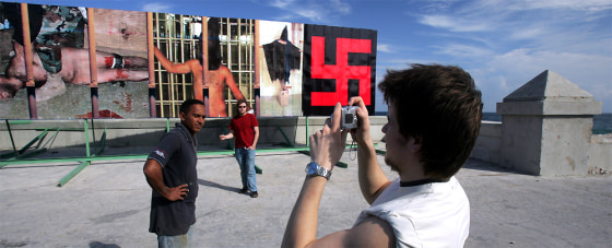 TAKING PICTURES IN FRONT OF BILLBOARD