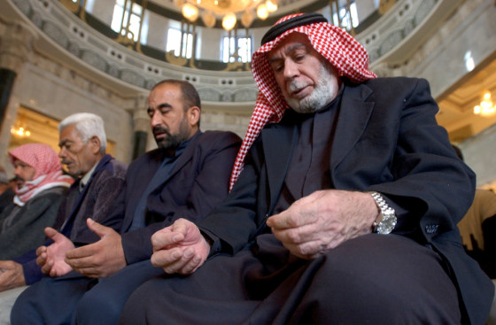 Iraqi Sunni Muslims pray in Um al-Qura mosque in Baghdad on Friday.
