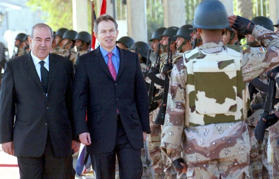 British Prime Minister Tony Blair inspects the Iraqi National Guard with Iraqi Prime Minister Ayad Allawi, left, on Tuesday in Baghdad.