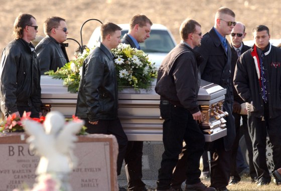 Pall bearers carry the casket of murder victim Bobbie Jo Stinnett in Skidmore