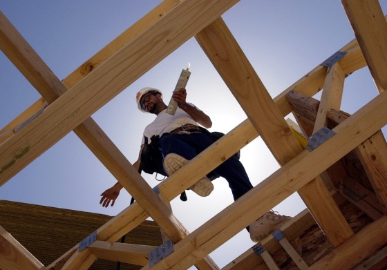 Construction worker Juan Jose Santana walks on the roof of a new home being built in Las Vegas, last April. Nevada again tops the list of fastest-growing states, followed by Arizona and Florida, according to The Census Bureau's annual estimate of the nation's population.
