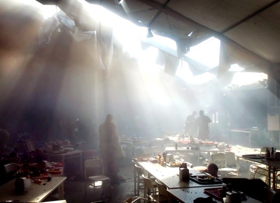A cloud of smoke covers a dining area inside a mess tent at Forward Operating Base Marez in Mosul, Iraq, on Tuesday, moments after an apparent insurgent rocket attack.