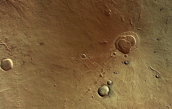 An image from the European Space Agency's Mars Express orbiter shows the Martian volcano known as Hecates Tholus, where repeated volcanic episodes have left overlapping lava flows.