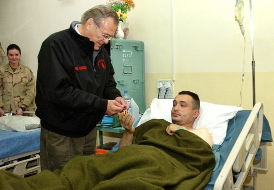 US Secretary of Defense presents purple heart medal to soldier during visit to Mosul