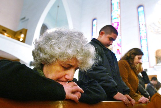 Iraqi Christians attend church service on Christmas Day in Baghdad