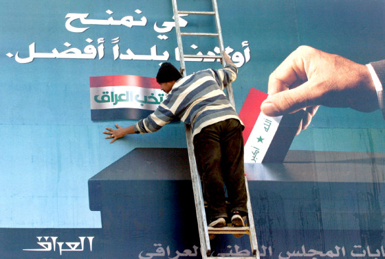 Billboard urging Iraqis to vote is prepared in Baghdad