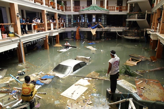 Rescue and clean-up crew survey a flooded lobby at the Seapearl Beach Hotel along Patong Beach on Phuket Island, Thailand, on Tuesday, Dec. 28, 2004 after massive tsunami waves smashed coastlines Sunday morning.