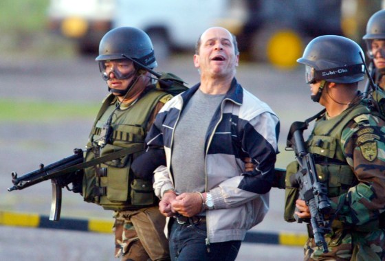 Rebel leader Ricardo Palmera is escorted by specials forces, at the military base in Bogota,&nbsp;after his arrest in Ecuador,&nbsp;Jan. 3, 2004.