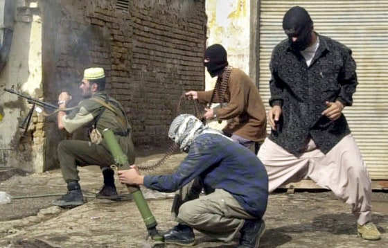 Insurgents, using small arms and mortars, launch an attack on U.S. forces in Fallujah in November, 2004.