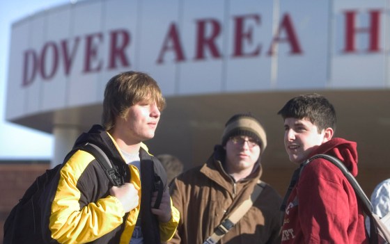 Freshman Wade Krumrine, left, and Justin Ort, right, leave Dover Area High School in Dover, Pa. for the day on Tuesday. Ort heard the four-paragraph statement on intelligent design during his ninth-grade biology class. Krumrine didn't hear it on Tuesday. The student at center could not be identified.