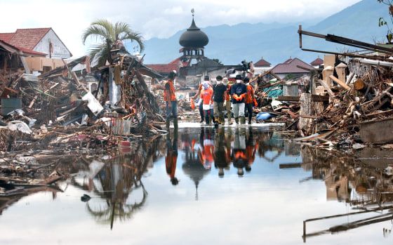 VOLUNTEERS REMOVE BODIES
