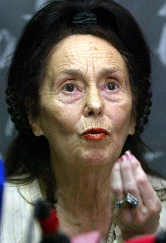 66-year-old Romanian who gave birth to baby girl gestures during a press conference in Bucharest