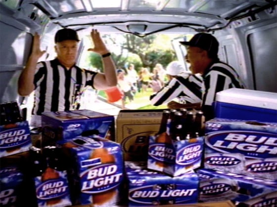 A frame grab of an Anheuser-Busch commercial shows referees celebrating the Bud Light they stole. Some critics say the marketing game between Bud Light and Miller Brewing has lost sight of true sportsmanship.