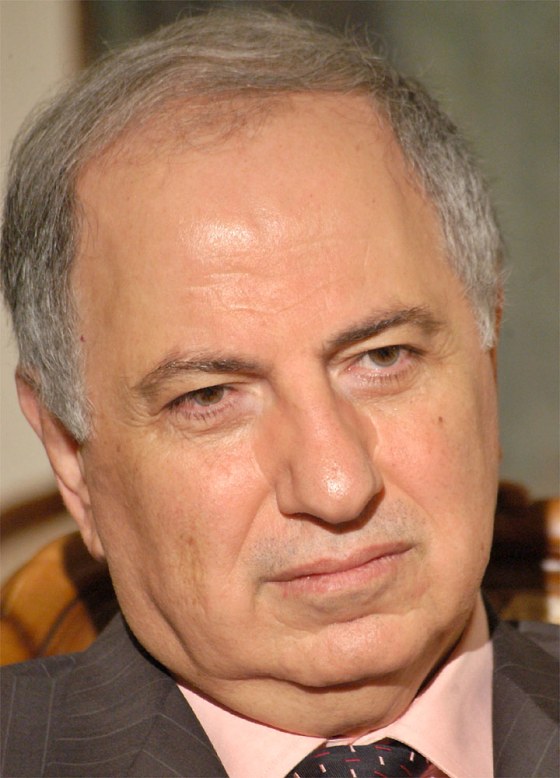 File photograph shows Iraqi politician Ahmad Chalabi speaking to a journalist in Baghdad