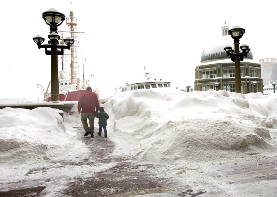 Snow keeps piling up in Boston, including Rowes Wharf on the waterfront, seen here on Wednesday.