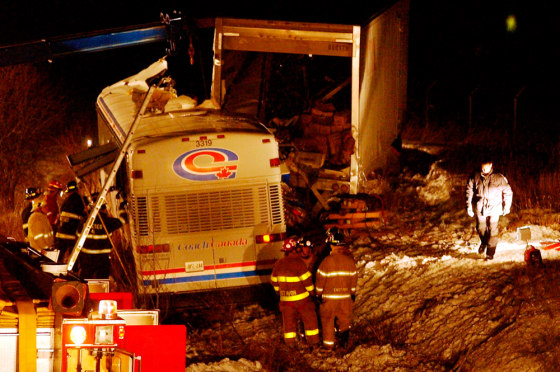 Fire crews and state police look over the scene of the crash on Saturday night.