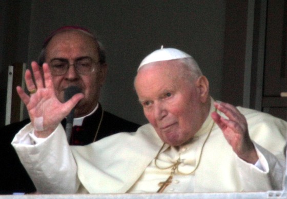 Pope John Paul II blesses the faithful from his suite at the Gemelli hospital in Rome on Sunday.