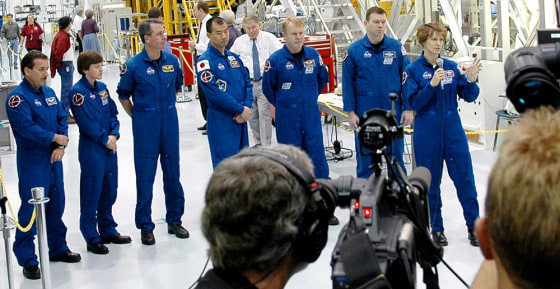 The crew of the upcoming shuttle mission faces reporters Thursday at NASA's Kennedy Space Center in Florida. From left are Charles Camarda, Wendy Lawrence, Stephen Robinson, Soichi Noguchi, Andrew Thomas, James Kelly and commander Eileen Collins. 