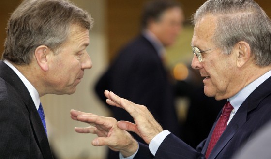 NATO Secretary-General de Hoop Scheffer and U.S. Defense Secretary Rumsfeld chat before start of 41st Conference on Security Policy in Munich